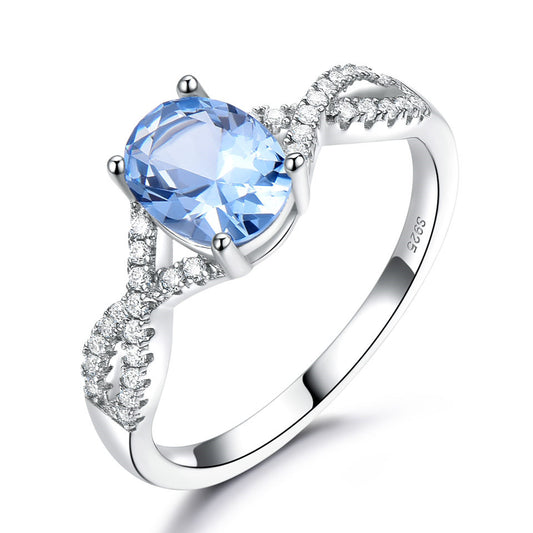 Sterling silver ladies ring with oval blue Morganite and pave diamonds