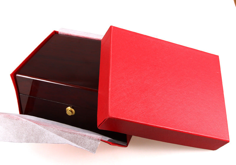 Painted watch box by edenista in red with dark wood interior and small gold knob