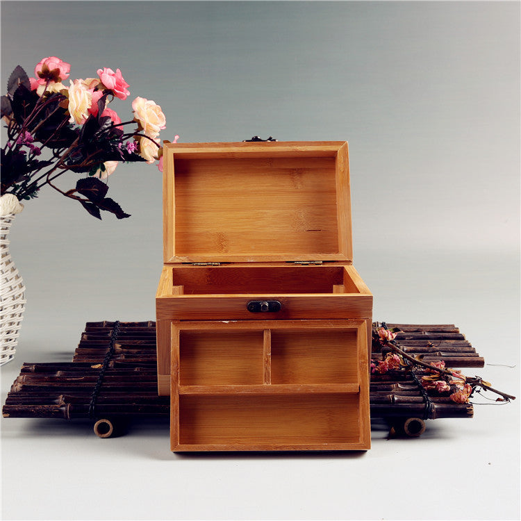 edenista bamboo wooden jewelry box with top lid open, a small central drawer, and two bottom compartments