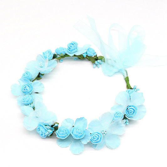 Bridal hair wreath with light blue artificial roses and petals, tied with pale blue ribbon