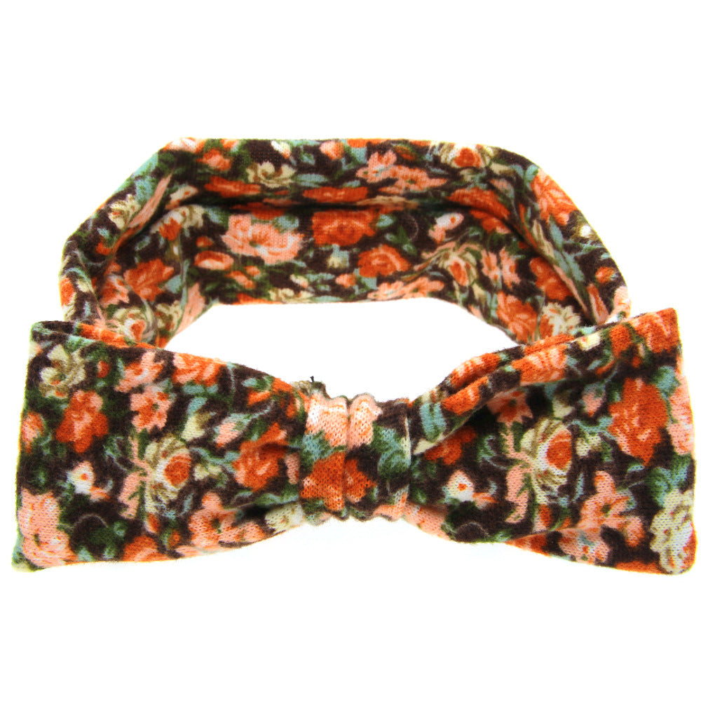 Floral children's hairband in multicolor floral print with gathered center fabric