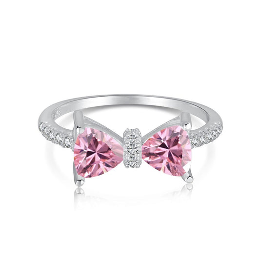 S925 sterling silver bow ring with pink crystal bow centerpiece and pave diamond accents along the band