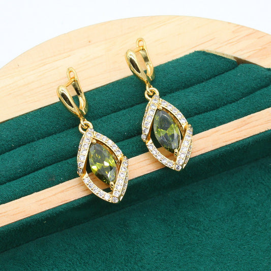 Earrings, gold-tone with green marquise-cut zircon centers and pavé halo