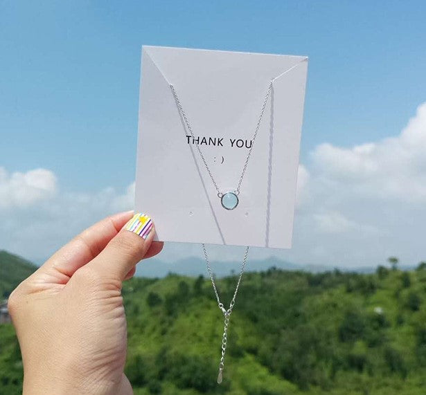 Necklace set with blue gradient round pendant on two silver chains