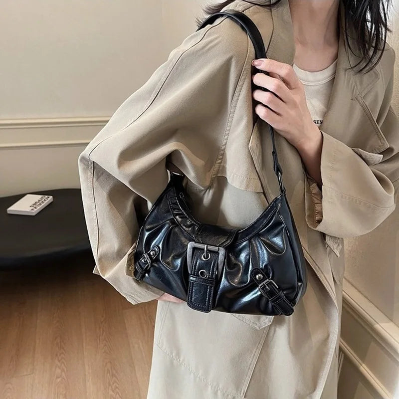 Women’s hobo handbag by Edenista, black faux-leather with buckle details carried over the shoulder