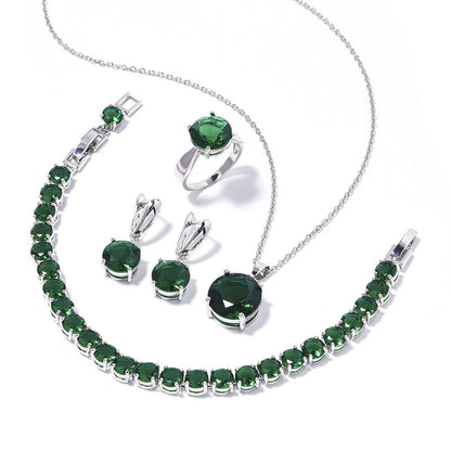 Geometric round emerald-green jewelry set, 4-piece silver-tone with emerald stones: necklace, bracelet, ring, earrings.