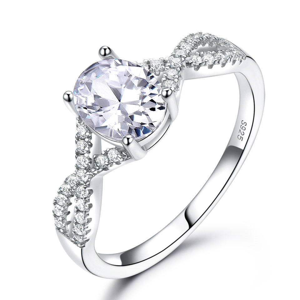 Sterling silver ladies ring with oval Morganite center stone and pave diamonds along split shank