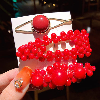 Girls' red beaded pearl clip set hair accessories with multiple glossy bead clips