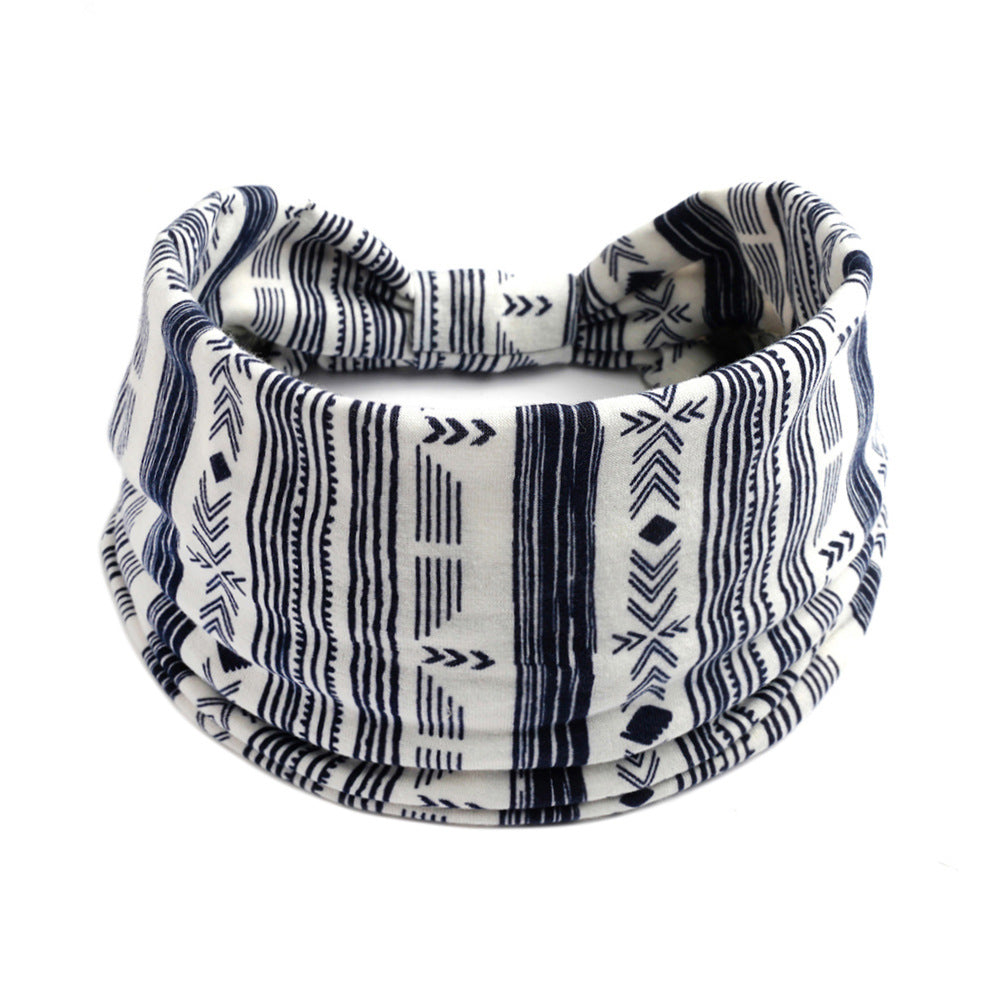 Bohemian Cashew yoga headband in white with navy geometric print