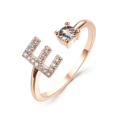 Ring: rose gold adjustable initial U letter with a diamond-studded motif and a solitaire stone