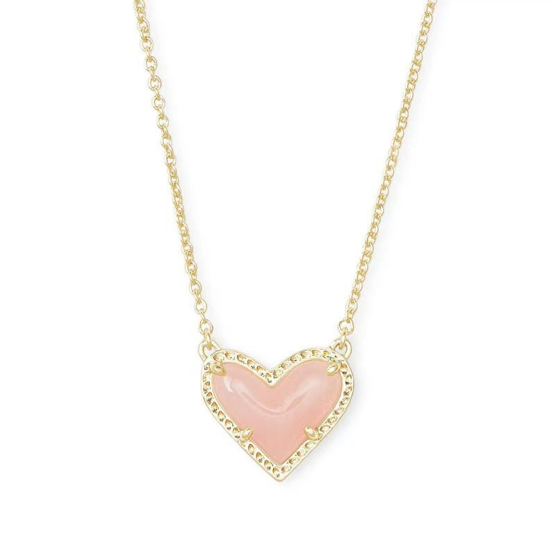 Cubic Zirconia Heart Pendant Necklace with pink heart centerpiece on gold chain by CJ