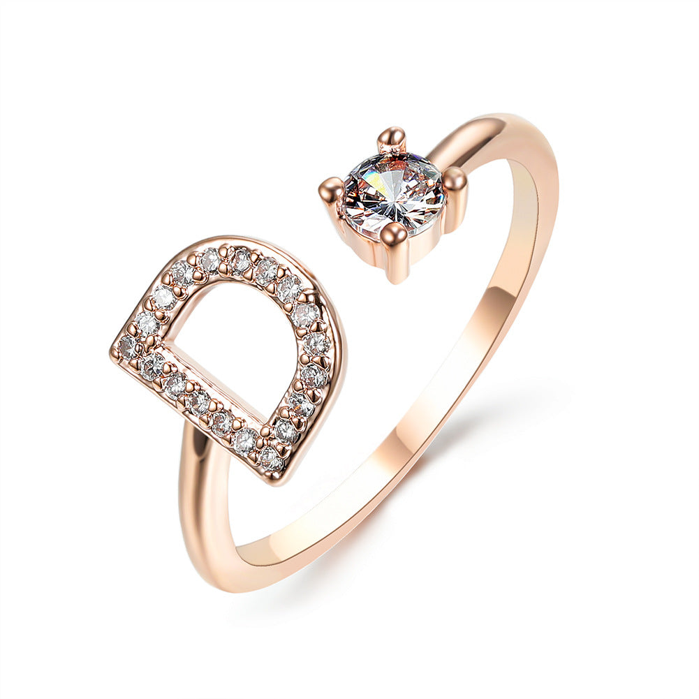edenista rose gold adjustable initial D ring with pavé diamonds and a solitaire diamond