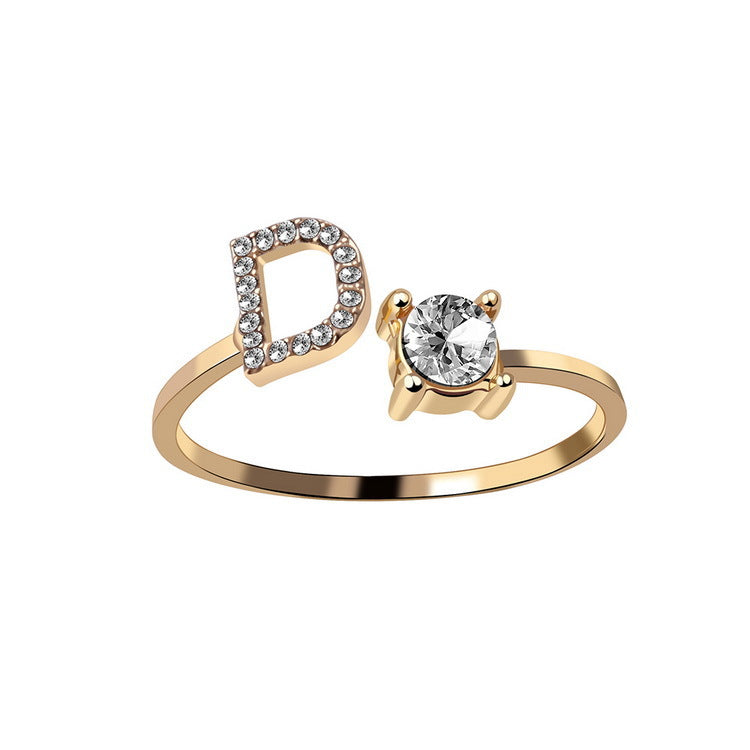 Gold ring with a diamond on a white background