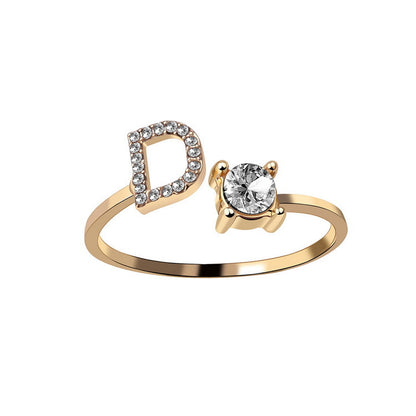 Gold ring with a diamond on a white background