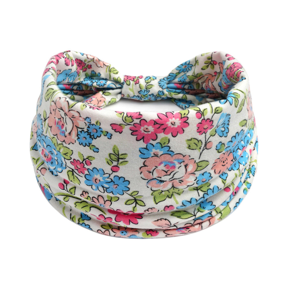 Floral yoga headband by CJ, multicolor Bohemian print, absorbent stretchy fabric.