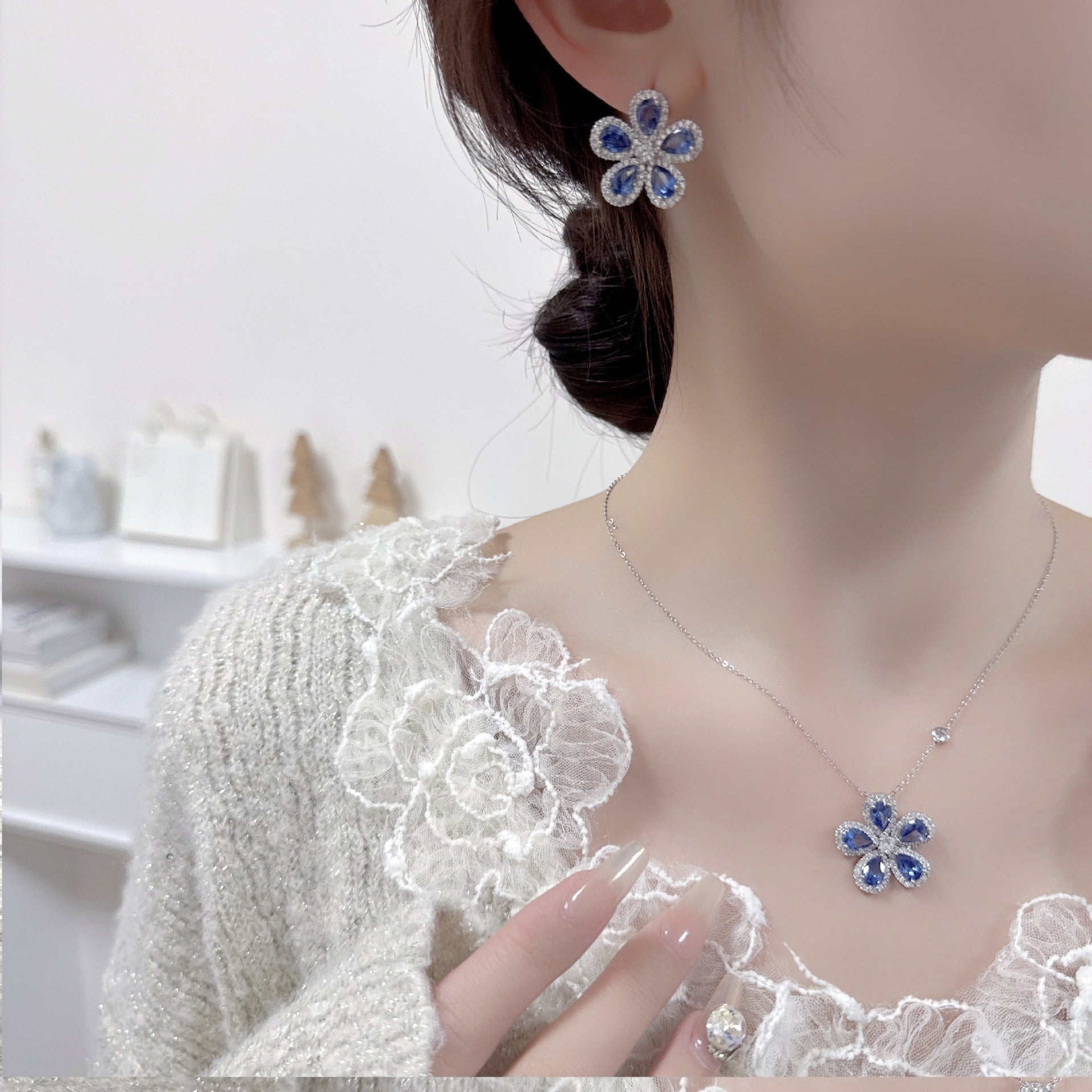 Two-piece sunflower earrings and necklace set with blue stones and clear zircon crystals