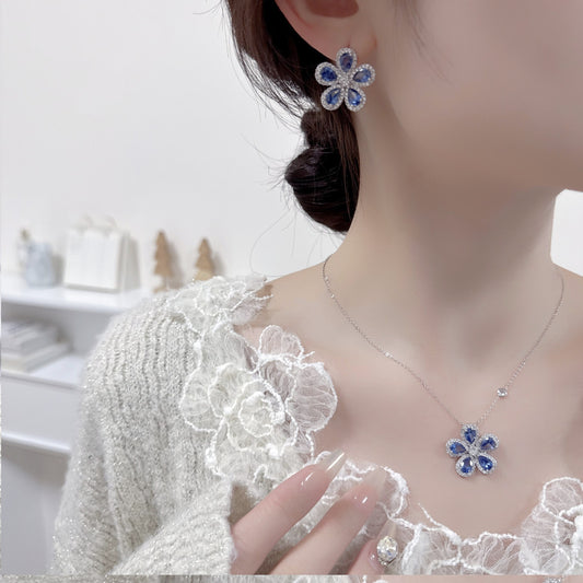 Two-piece sunflower earrings and necklace set with blue stones and clear zircon crystals