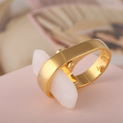 Rectangular natural stone ring with gold-tone band and white stone, CJ brand