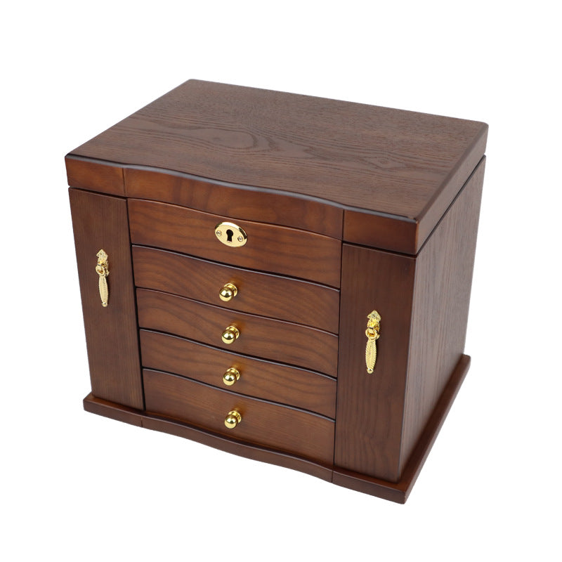 Wooden jewelry box by edenista, brown wood with gold knobs and curved-front drawers