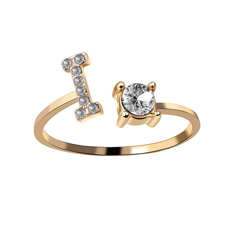 Edenista adjustable gold-tone initial letter ring with crystal-studded bar and a solitaire crystal end