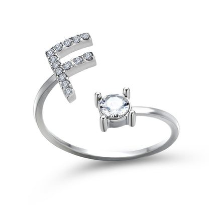 Adjustable silver-tone ring featuring a pavé crystal arc and a solitaire round stone in a prong setting.