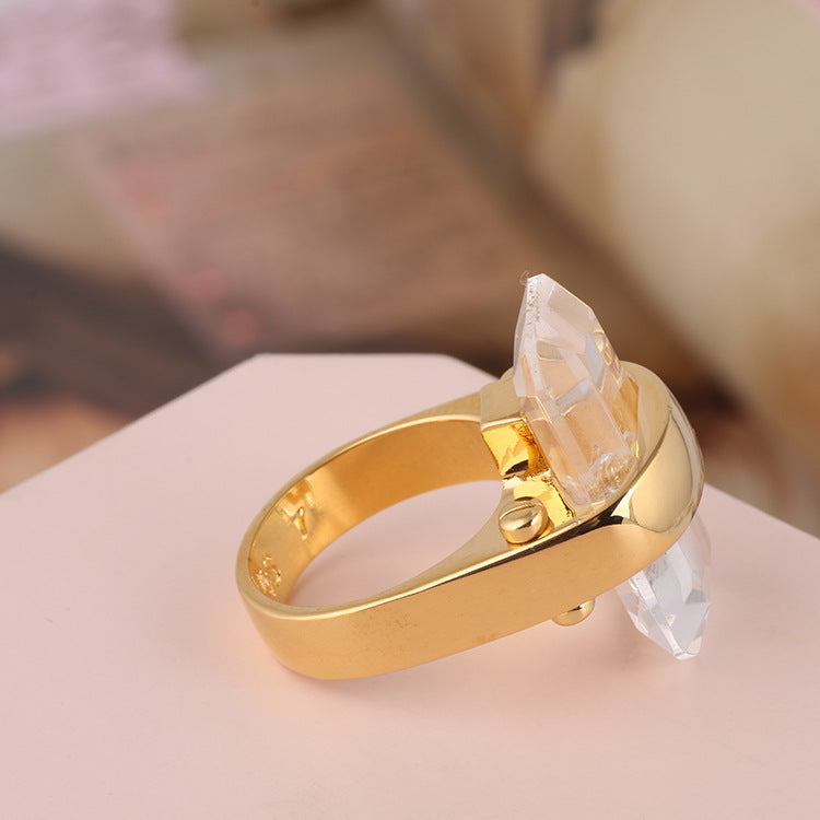 Gold ring with a clear rectangular natural stone crystal accent