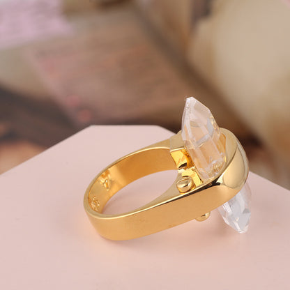 Gold ring with a clear rectangular natural stone crystal accent