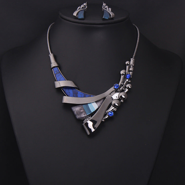 Jewelry set by cj: geometric blue and silver necklace with matching earrings