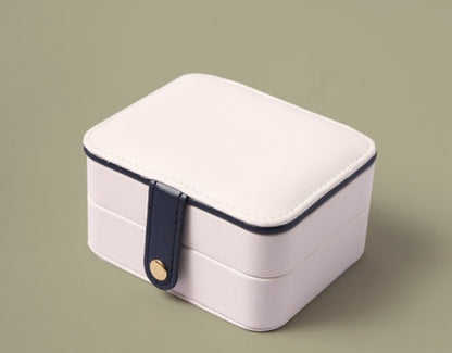 Portable jewelry box by edenista, white with navy strap and gold button clasp