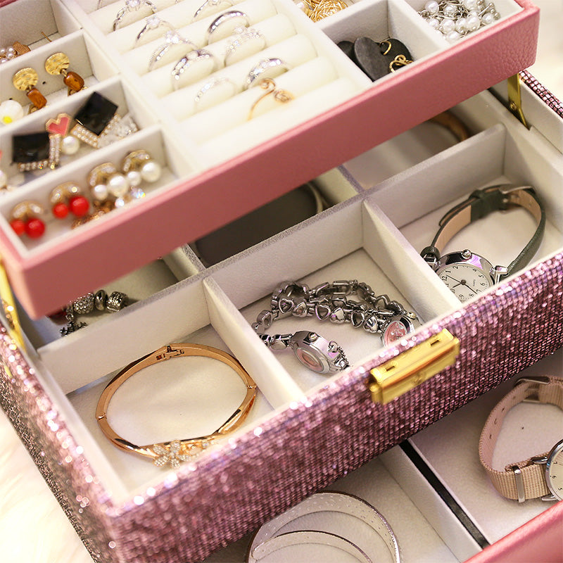 Organizing box by edenista with pink glitter exterior, flannel tray, and compartments for rings, bracelets, and earrings