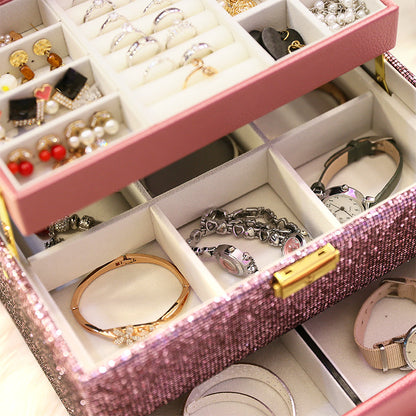 Organizing box by edenista with pink glitter exterior, flannel tray, and compartments for rings, bracelets, and earrings