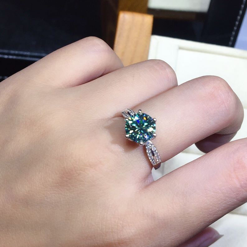 Ring: 925 silver adjustable band with blue-green moissanite center stone
