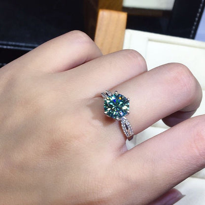 Ring: 925 silver adjustable band with blue-green moissanite center stone