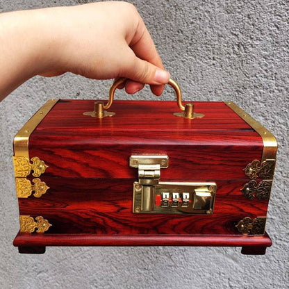 Portable password jewelry box in mahogany with brass hardware and a combination lock, held by a hand.