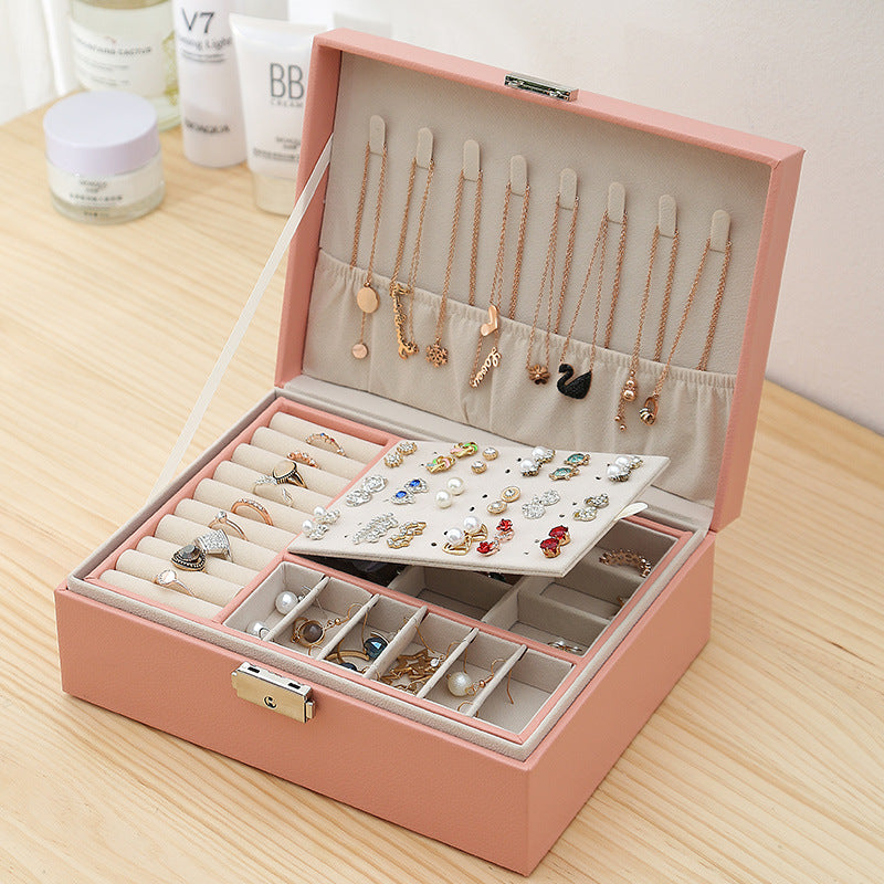 Double-layer leather jewelry storage box in pink with lid necklace hooks, ring tray, and earring organizer