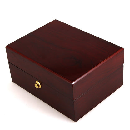 Wooden watch box in dark cherry finish with a brass knob drawer