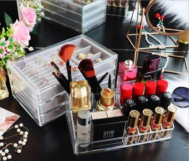 Acrylic jewelry and makeup organizer by edenista with clear compartments for brushes, lipsticks and jewelry.