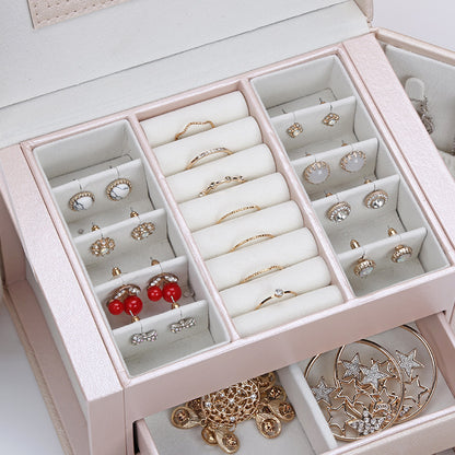 Pink double-layer PU leather jewelry box with cushioned ring and earring compartments, holds multiple pieces.
