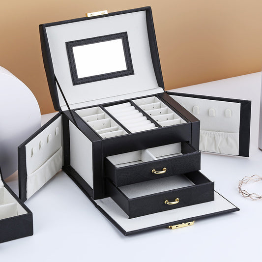 edenista double-layer PU leather jewelry box with mirror lid, ring slots, side pockets, and two pull-out drawers.
