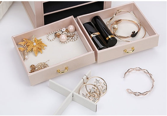 Double Layer Large Capacity PU Leather Jewelry Box by edenista, pink-beige exterior with drawers and assorted jewelry.