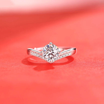 Women's imitation moissanite ring by CJ; silver-tone band with a central round stone and pave accents