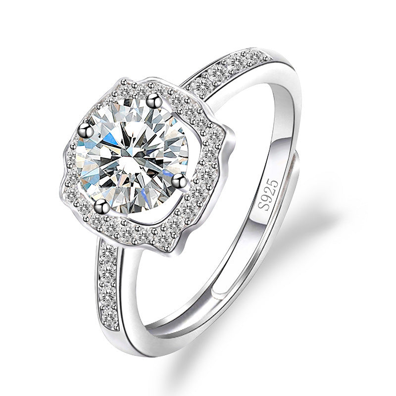 Women's sterling silver moissanite ring with a halo setting and pave band