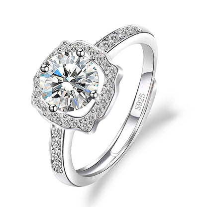 Women's sterling silver moissanite ring with a halo setting and pave band