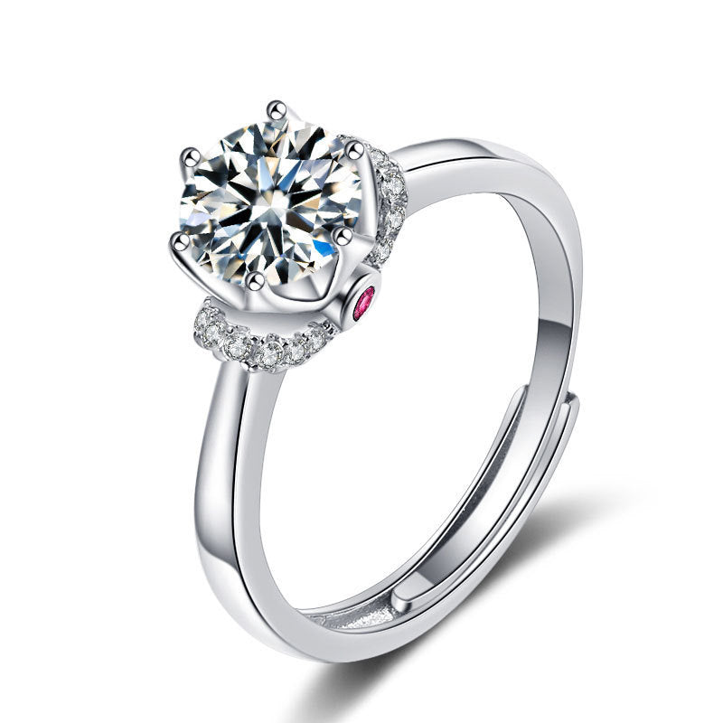Moissanite ring in silver-tone metal with a large round center stone and pave side diamonds