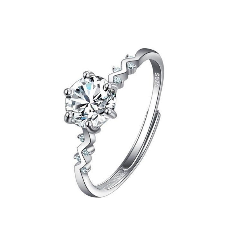 Women's moissanite ring with a large round center stone, silver S925 band with small side stones cj