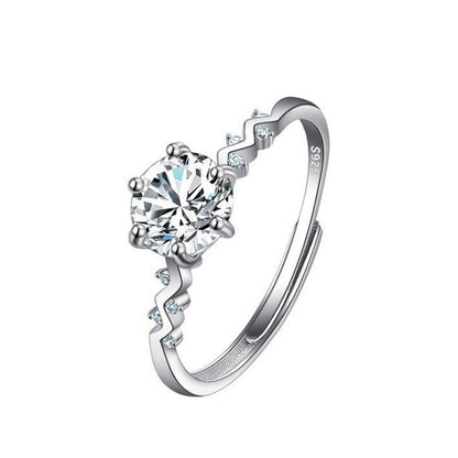 Women's moissanite ring with a large round center stone, silver S925 band with small side stones cj