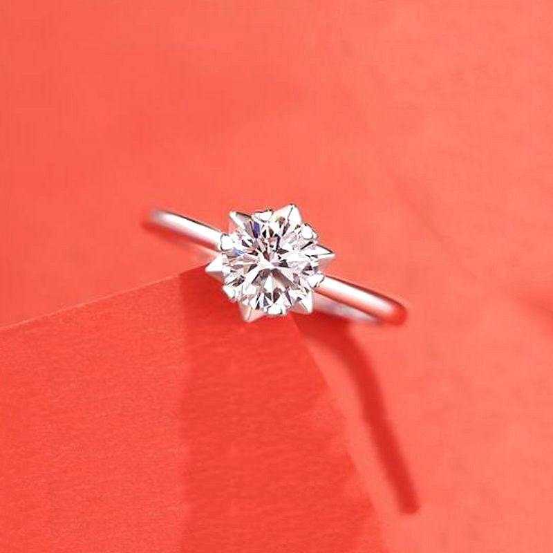 Female Ring Imitation Moissan Diamond Ring with silver-tone band and round center stone