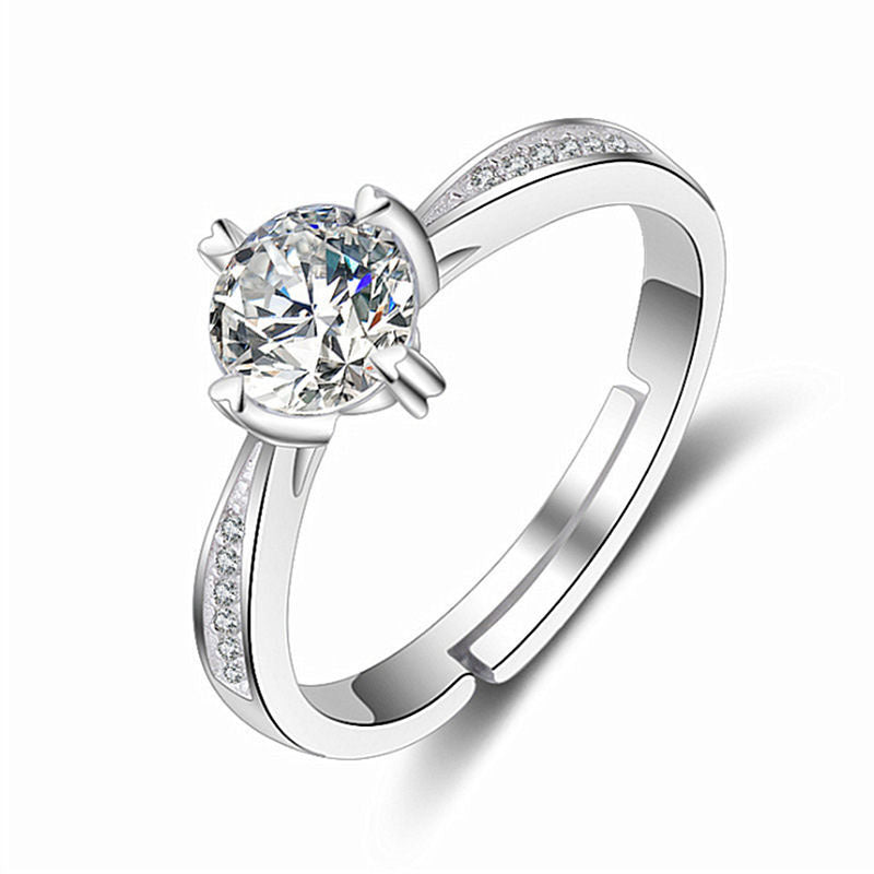Women's moissanite ring with solitaire center stone and pavé band in silver