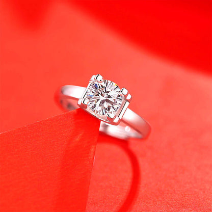 Women's ring with imitation moissanite diamond in a silver-toned setting