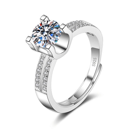 Women's moissanite ring with a large round sparkling center stone and pave-set band in sterling silver S925